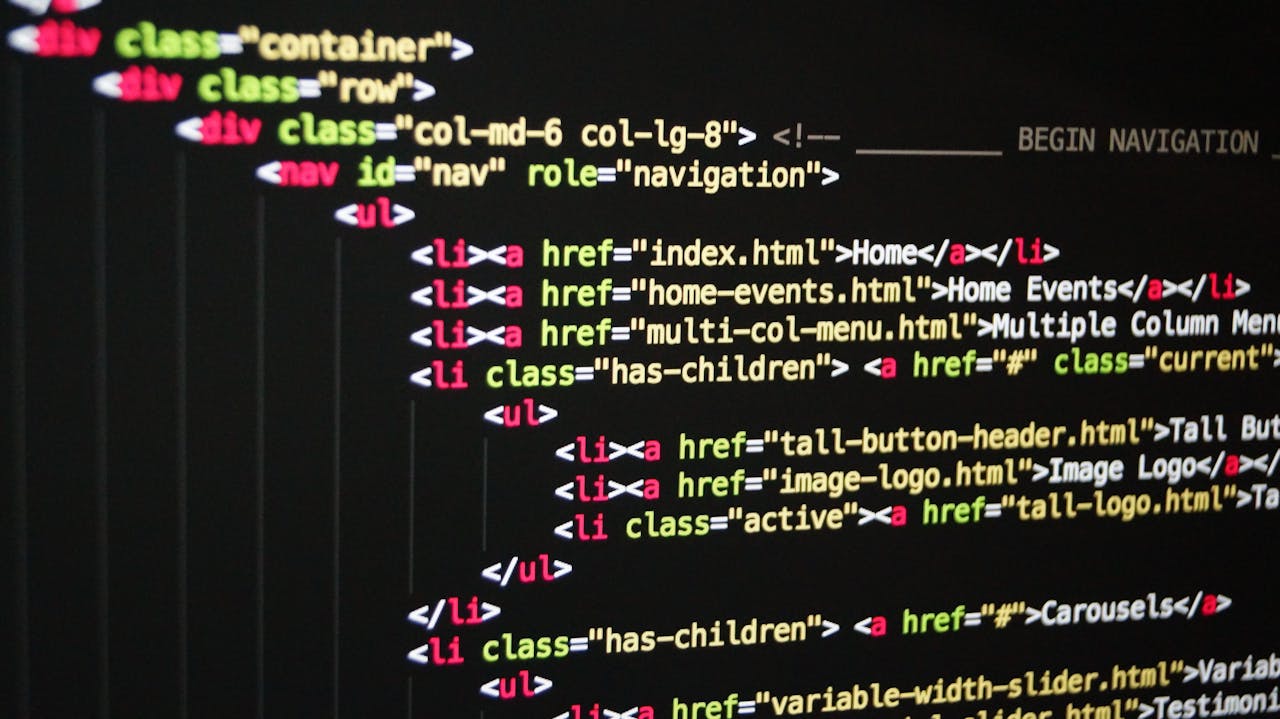 services-04 Close-up of vibrant HTML code displayed on a computer screen, showcasing web development and programming.