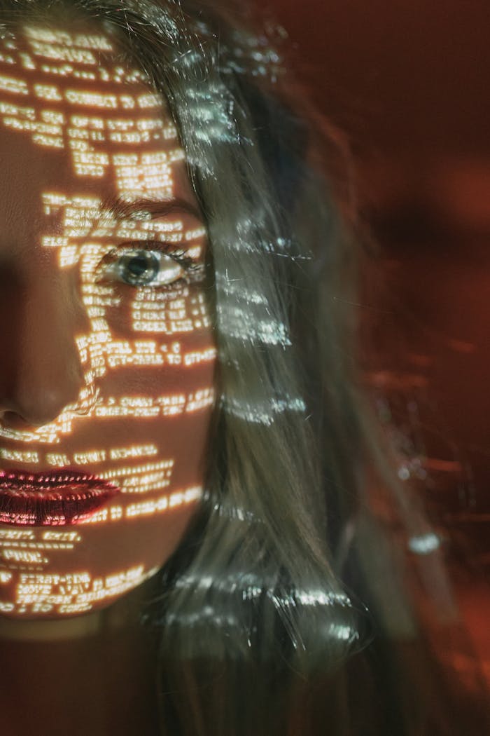 team-01 Abstract cyberpunk portrait with code projected on a woman's half face, symbolizing technology integration.